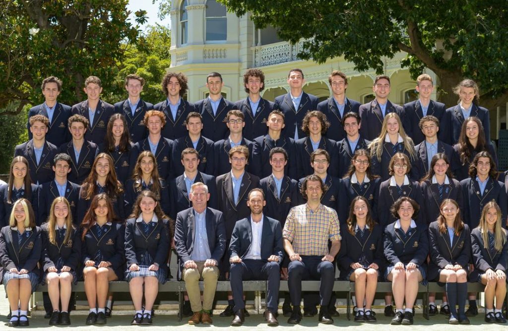 Year 12 students pose for their school photo