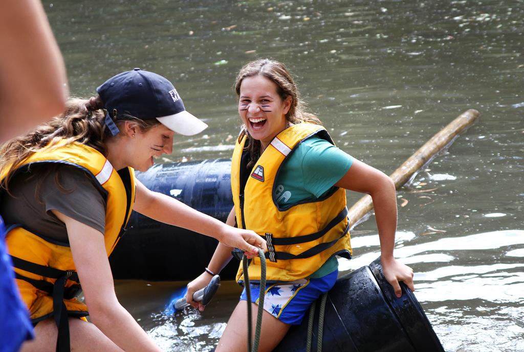 Two students on the water enjoying camp