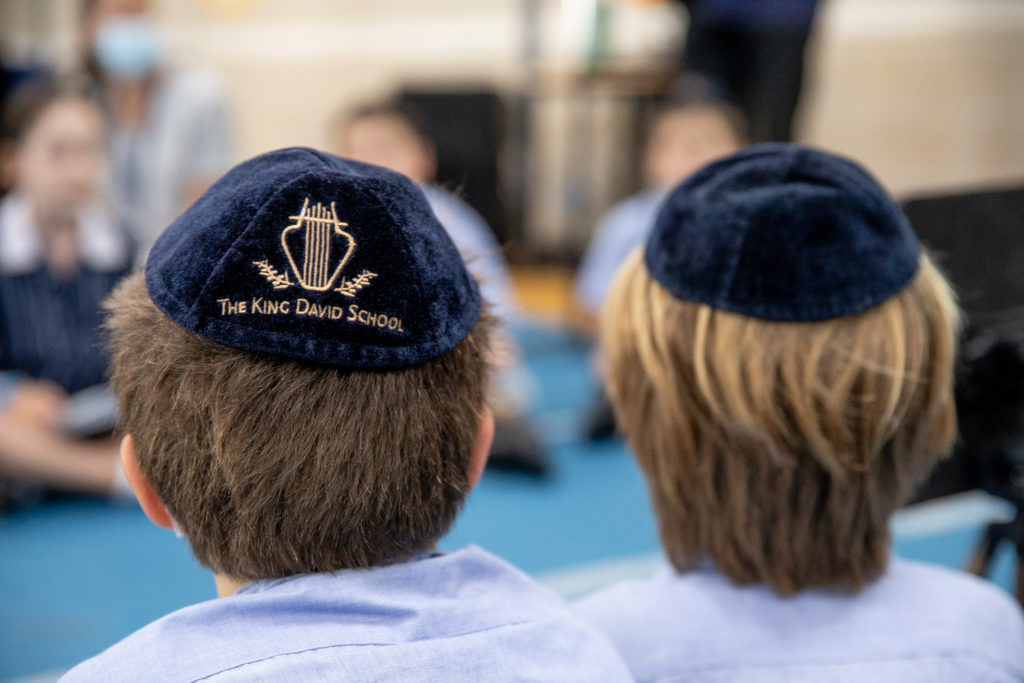 Two King David students with kippah on their heads