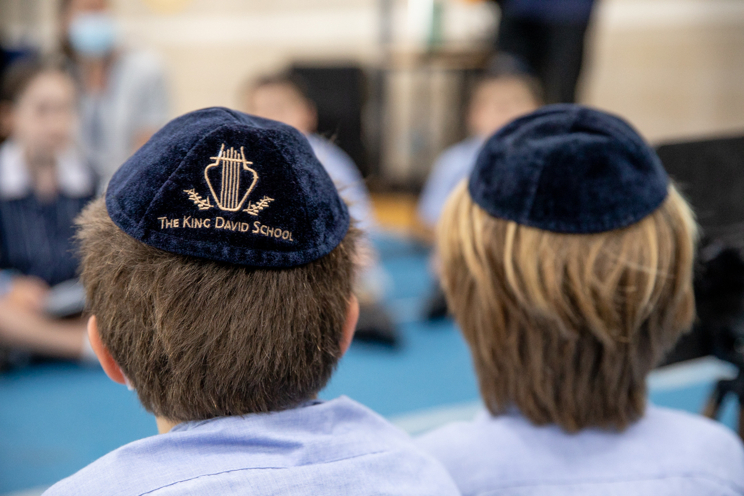 Two King David students with kippah on their heads