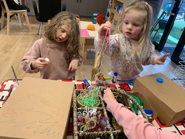 ELC students recycle and create with paper and cardboard