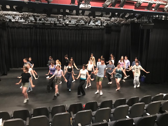 Students on stage dancing at Shir Performing Arts Camp