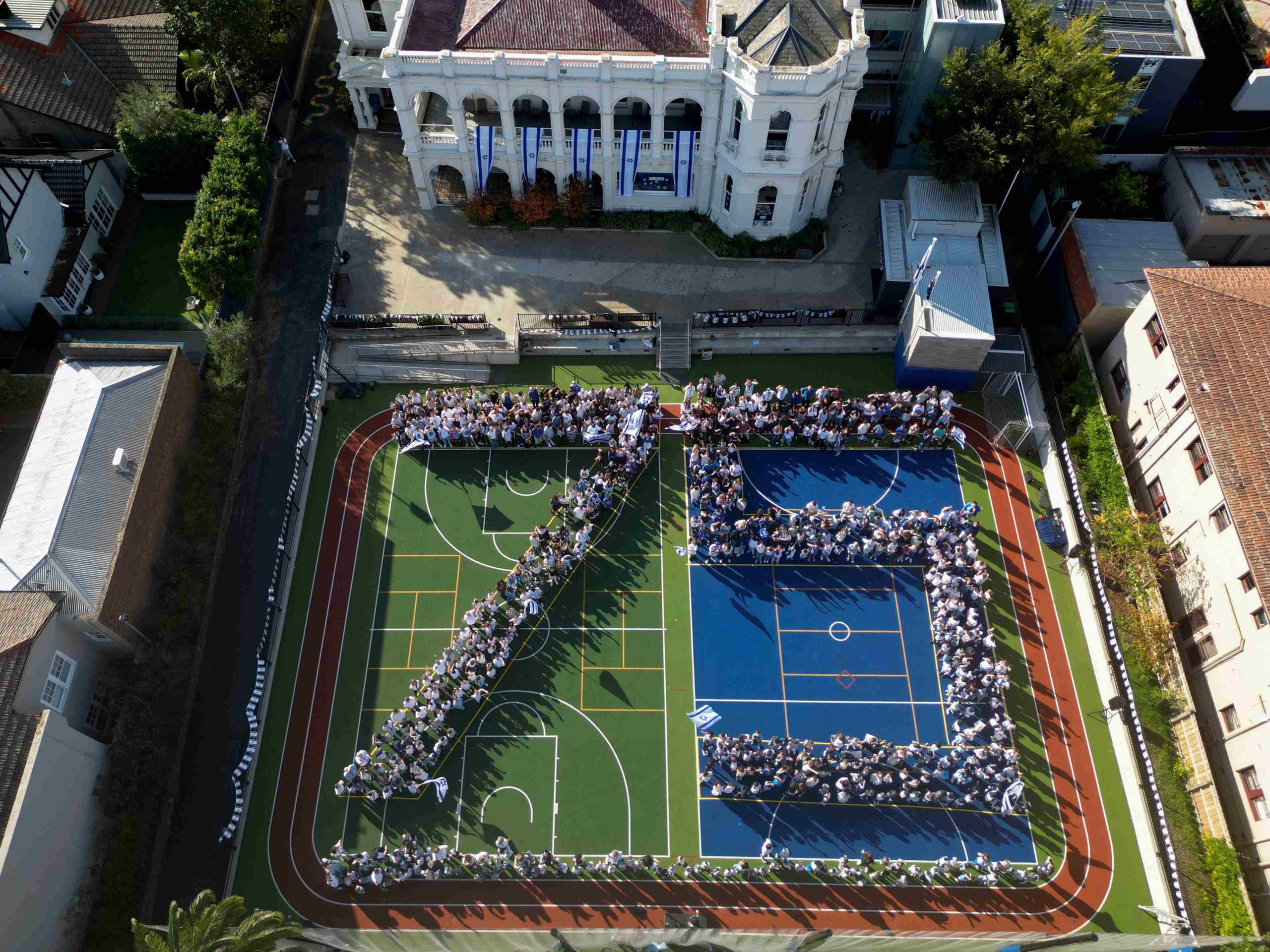 King David School students and staff are seen from the air in formation of a 75 to celebrate Yom HaAtzmaut and Israel's 75th birthday