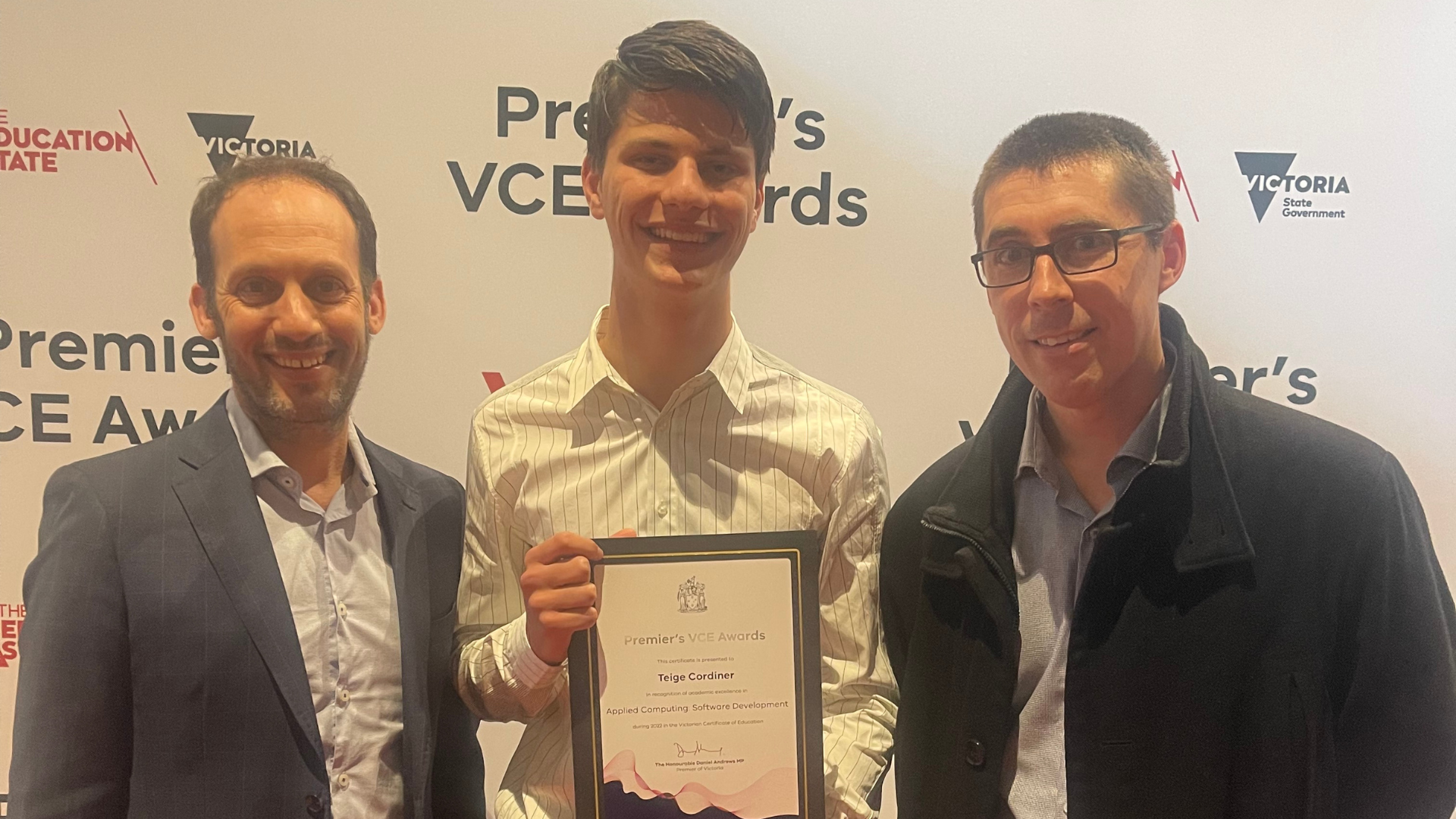 Premier's Award recipient Teige stands with the Principal Marc Light and his teacher Heath McGregor after being awarded his award