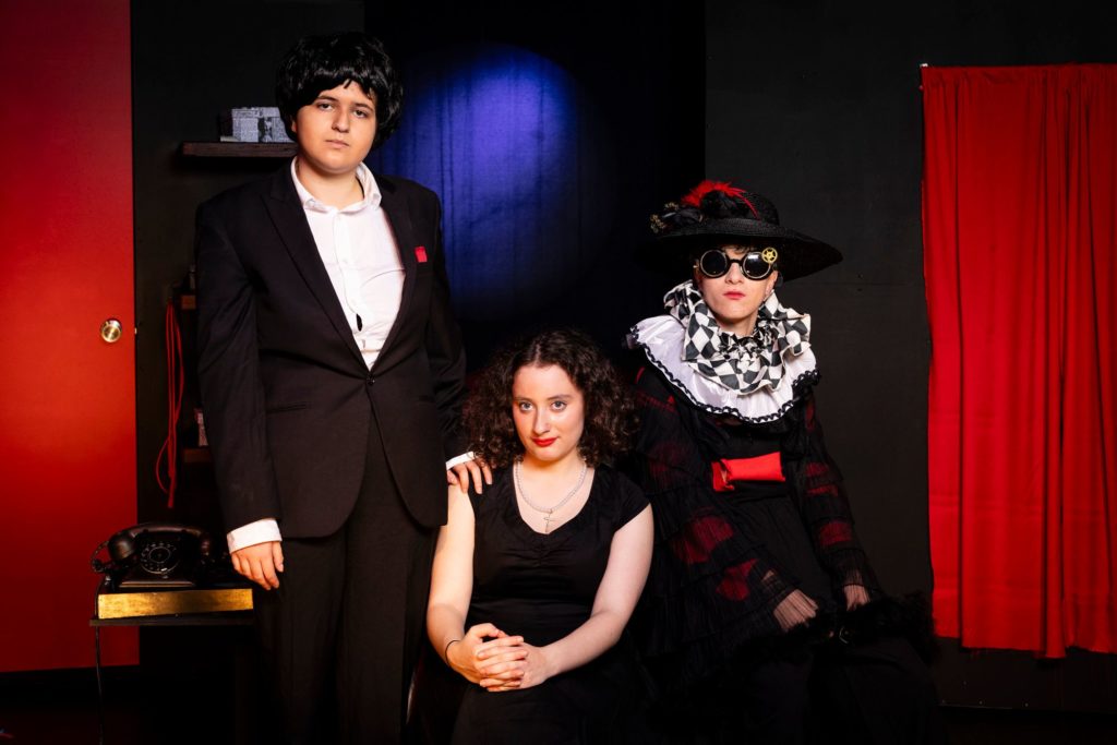 Three VCE Theatre Studies students are in costume. They have just performed in the play Ruby Moon.