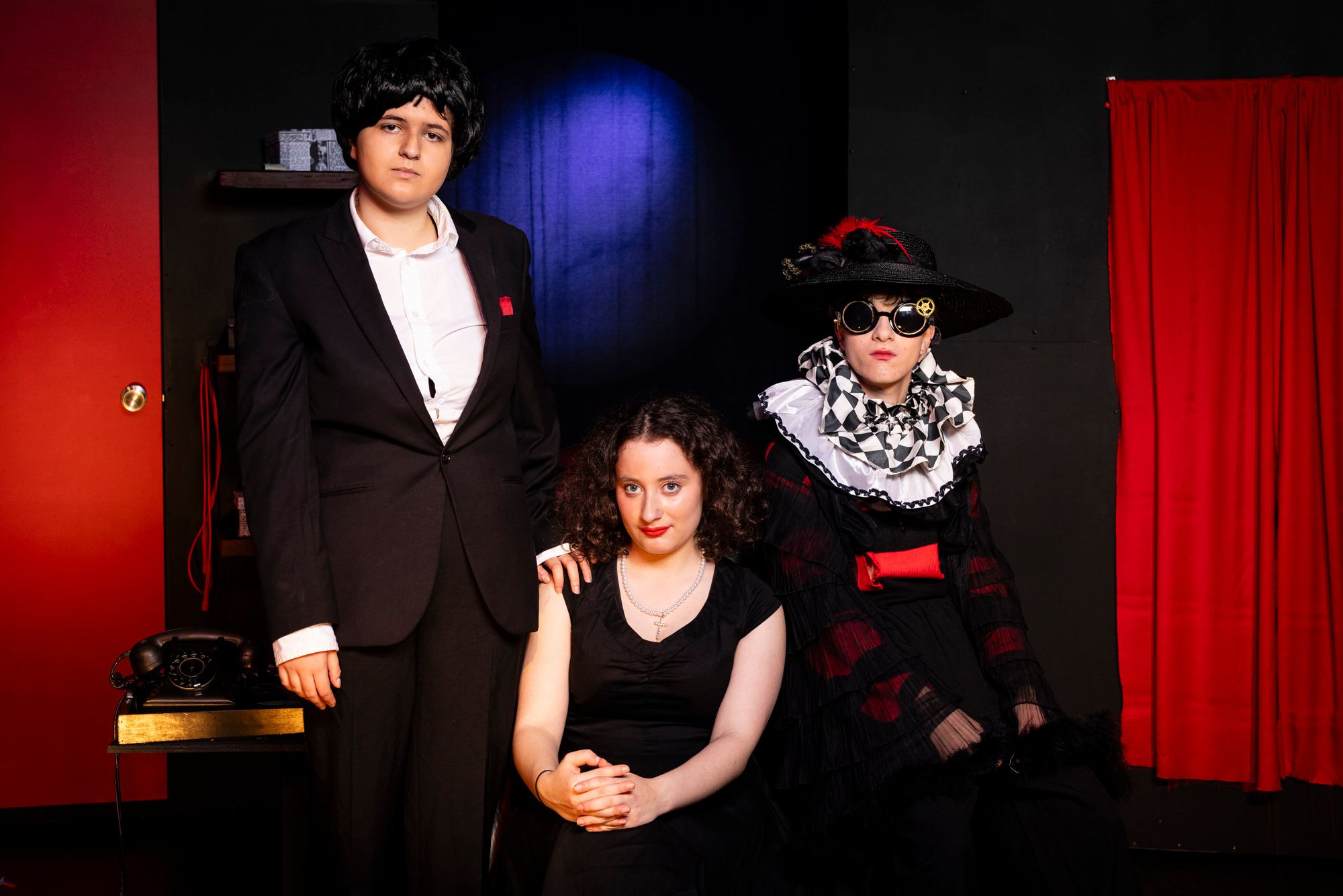 Three VCE Theatre Studies students are in costume. They have just performed in the play Ruby Moon.