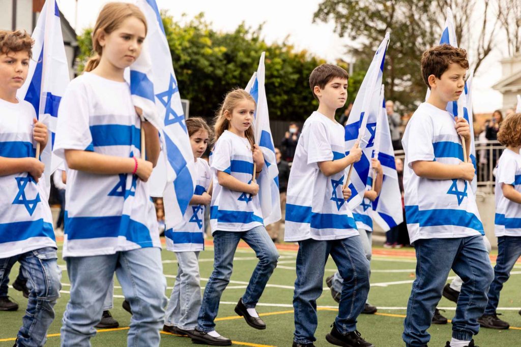 Year 4 students are participating in the annual flag parade for Yom HaAtzmaut