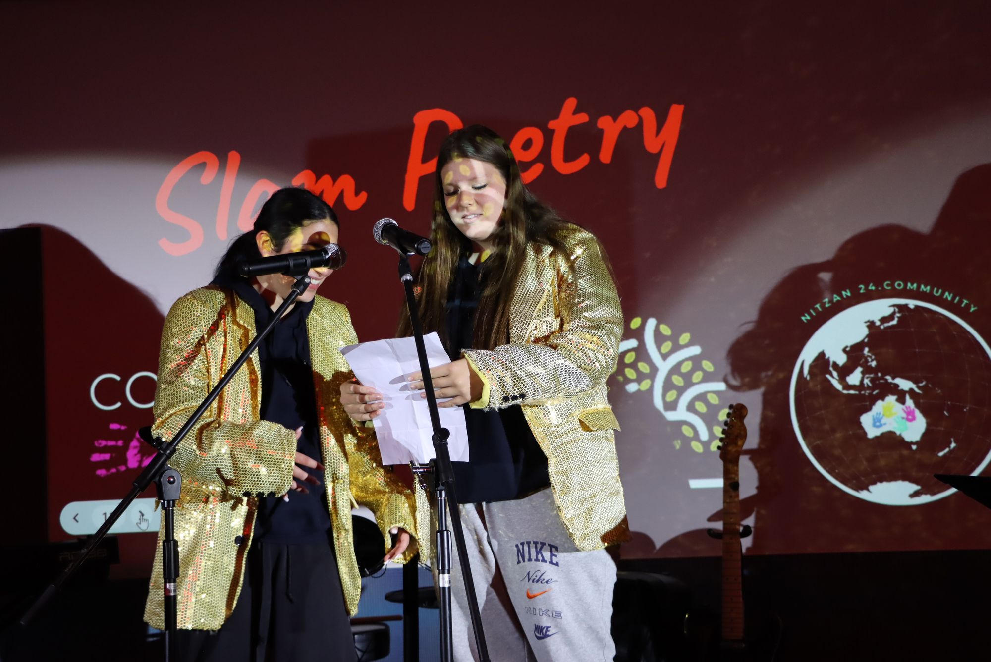 Two Year 9 students perform their slam poetry at Artivism - art for social change.