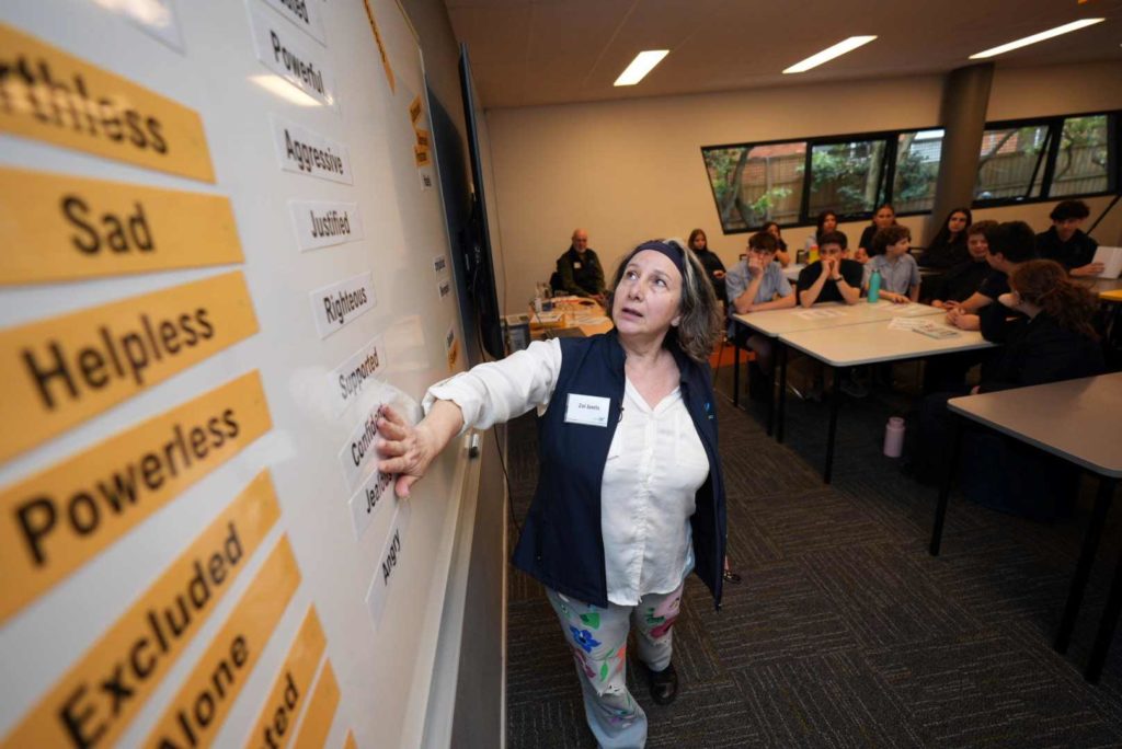 Year 10 students are listening to a representative from Courage to Care who is teaching them about being Upstanders instead of Bystanders.