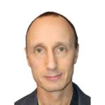 Council member Jason Rose is looking at the camera. We can see from his shoulders to the top of his head.