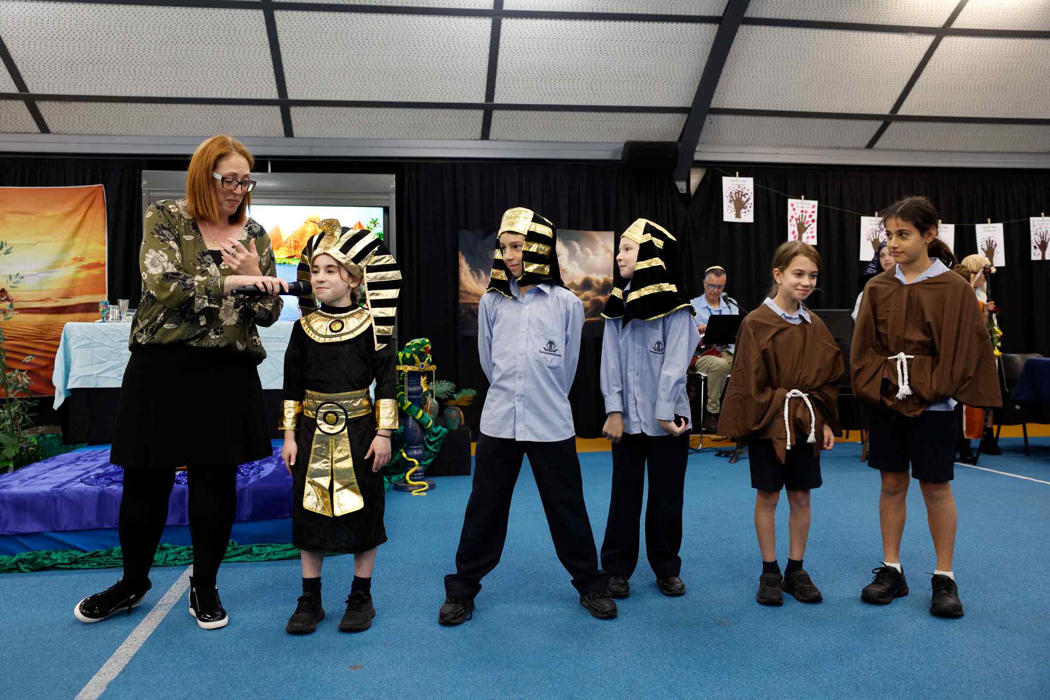 Years 3-5 students are in costume as Pharoahs and slaves. They are acting out the story of Pesach and our exodus from Egypt. They are having a Pesach seder at school.