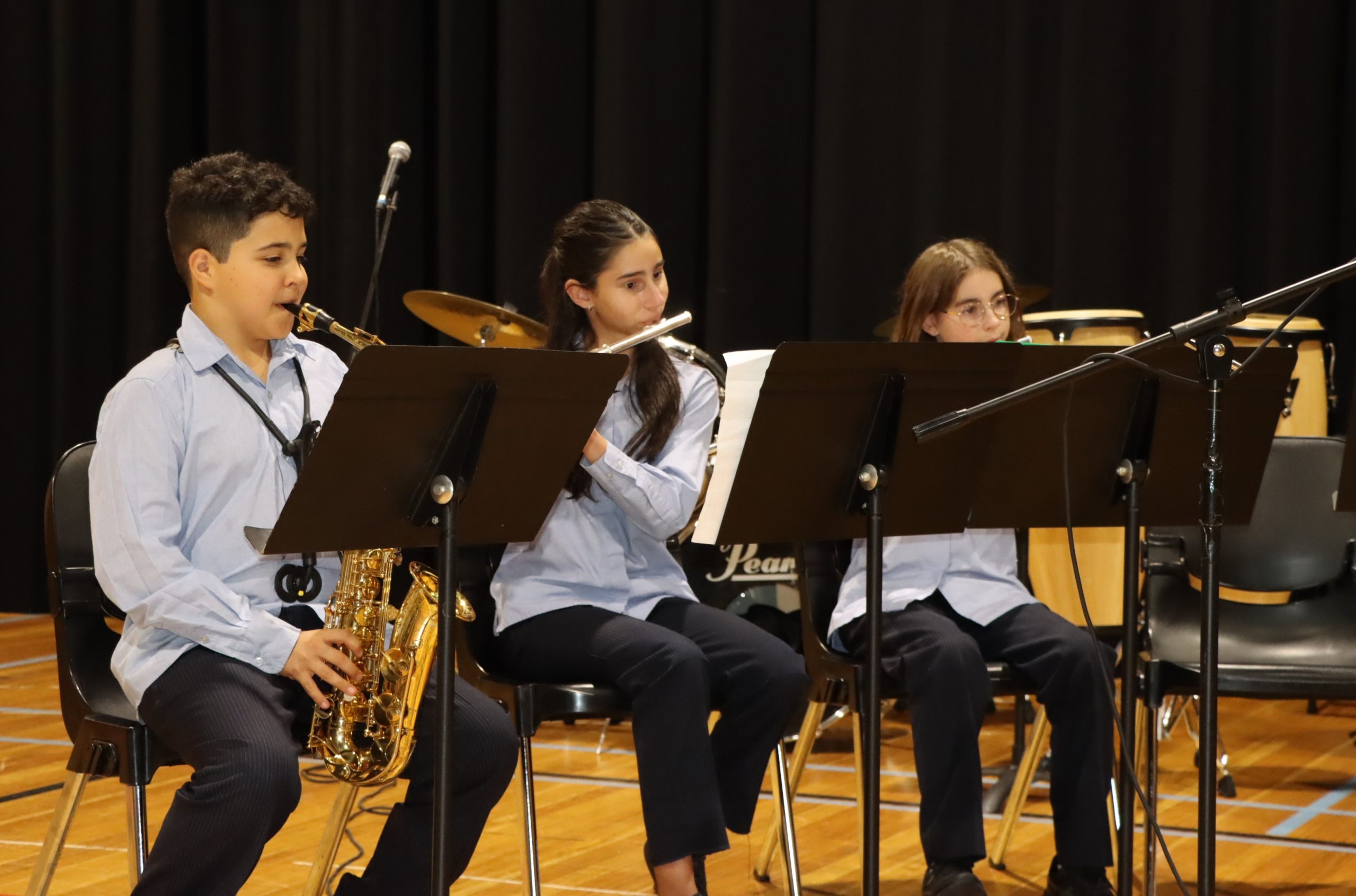 Students in the Wind ensemble play the saxophone and flutes at our Middle and Senior School Ensemble music performances