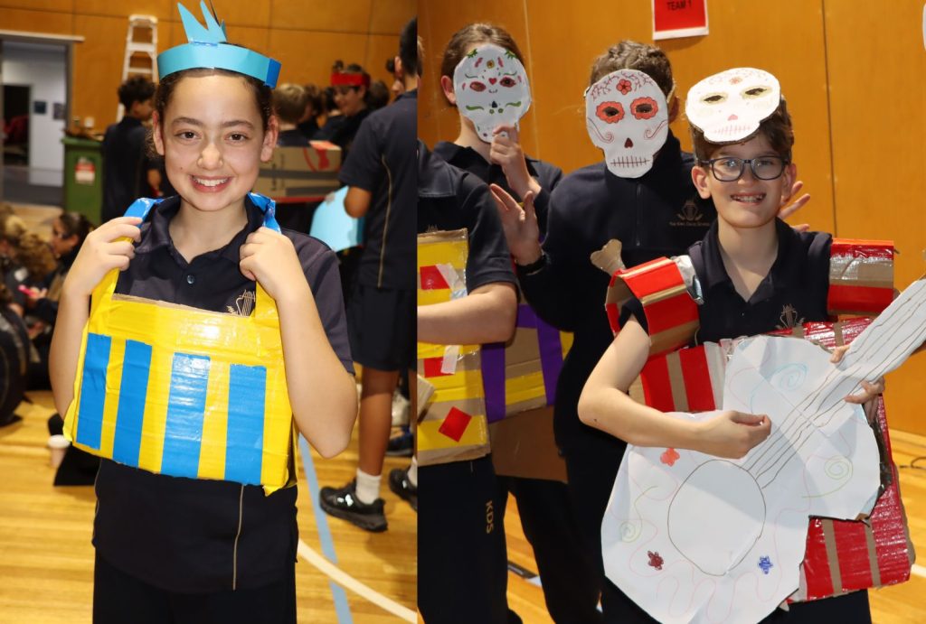 Students pose with clothing creations they have made from duct tape for Project Slingshot. They have worked creatively and collaboratively together.