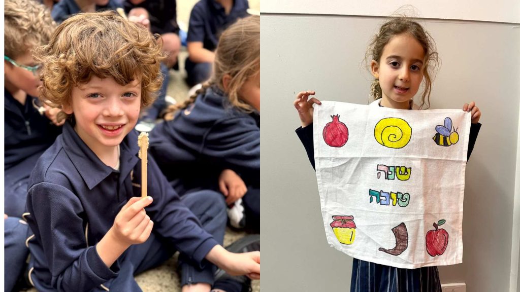 One Junior School student holds honey scraped fresh from a beehive. The other student holds a teatowel that she has painted that has Rosh HaShanah symbols on it. They are celebrating Rosh HaShanah together at the Junior School.