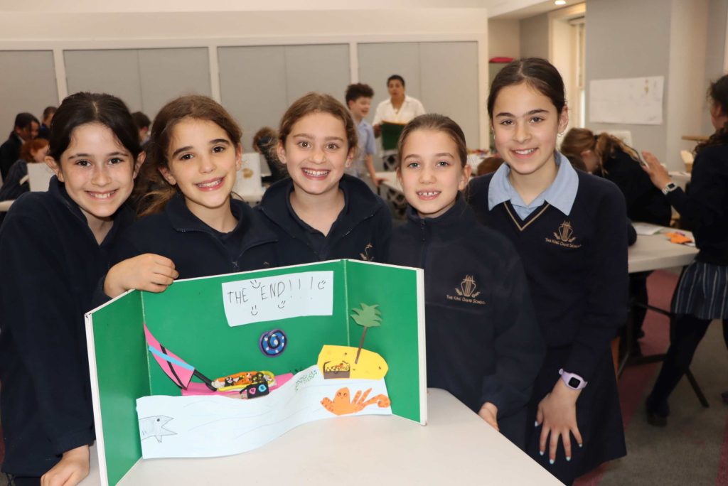 Year 4 students pose in front of their Stop Motion set. They have made a Stop Motion Animation together.