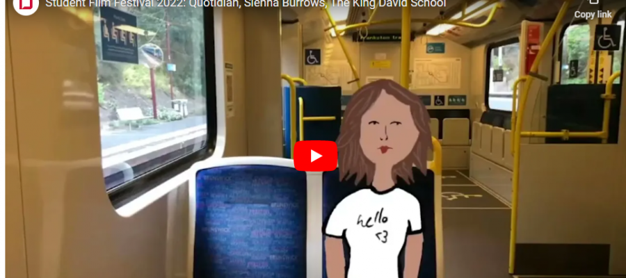 The image is a still from a student's film that won highly commended in the Independent Schools Victoria Film Competition. It shows a girl sitting on a bus, wearing a vintage-style white t-shirt.